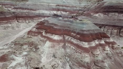 amazing barren eroded sandstone hills in utah desert which looks like another planet landscape, aerial view