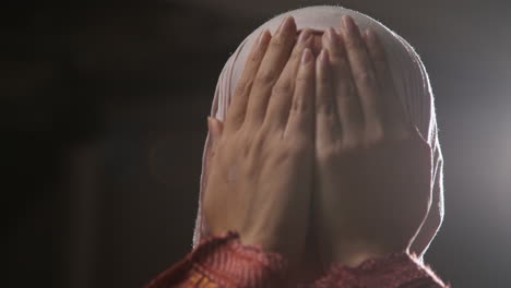 Studio-Head-And-Shoulders-Portrait-Of-Muslim-Woman-Wearing-Hijab-Praying-8