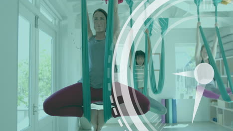 animation of scanner processing over diverse female instructor and teenage girls doing aerial yoga