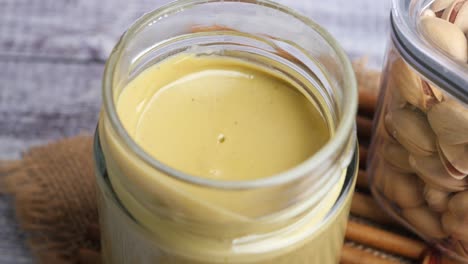 pistachio butter in a glass jar