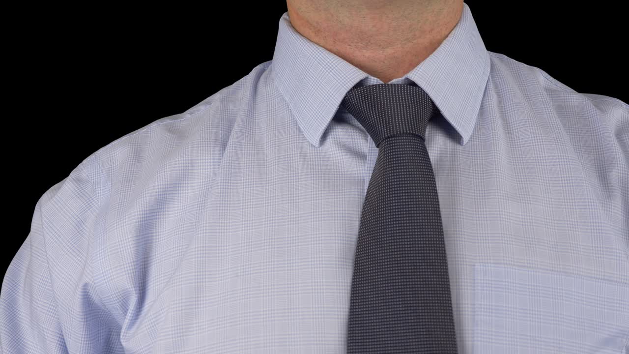 Stylish caucasian man in suit and tie. Business style. Fashionable image. Office worker. Sexy man standing and tied tie knot. Green screen alpha channel transparent background.