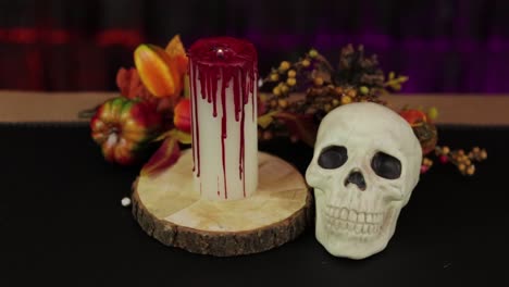 Skull-and-bloody-candle,-steadycam