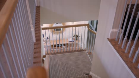 view down luxurious carpeted staircase in upscale home