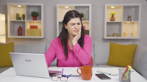 home office worker woman teeth aches and pains.