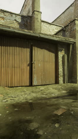 exploring an abandoned industrial site with weathered buildings and debris