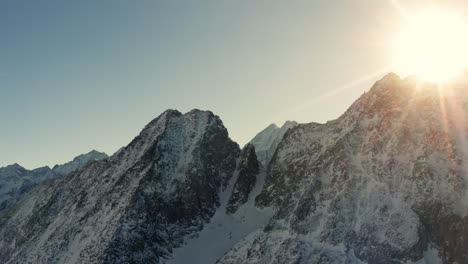 Aerial-drone-shot-of-Italian-Mountains-in-Wintertime-before-Senset