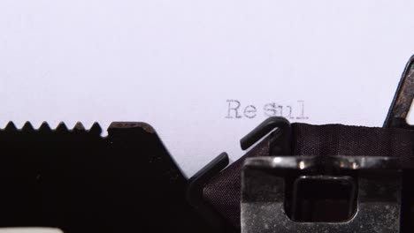 Typewriter typing the word "Results"