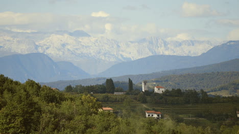 picturesque alpine valley with snow-capped mountains