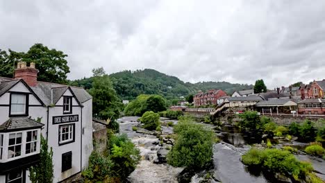 picturesque river and buildings in llangollen, wales