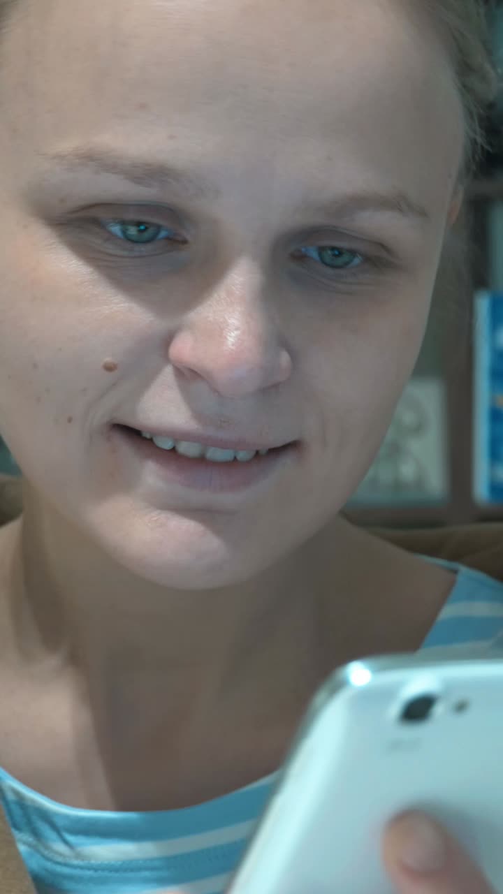 A woman looking at her phone