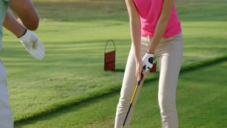 two golfers playing golf together