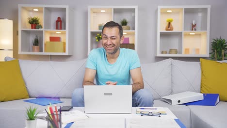 home office worker man winks at camera.