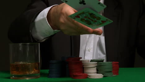 Cool-gambler-throwing-down-his-poker-hand