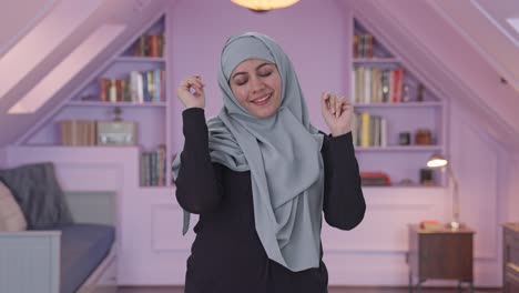 happy muslim woman dancing and enjoying