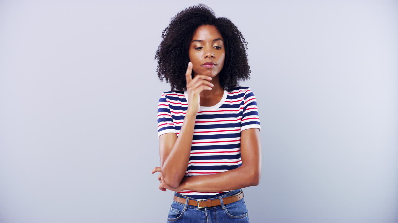 Thoughtful Woman in Striped Shirt