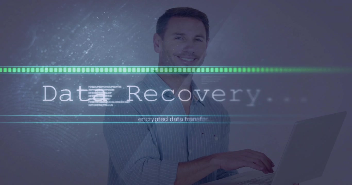 Laptop user typing starting data recovery overlay while progress bar advancing and restoring files