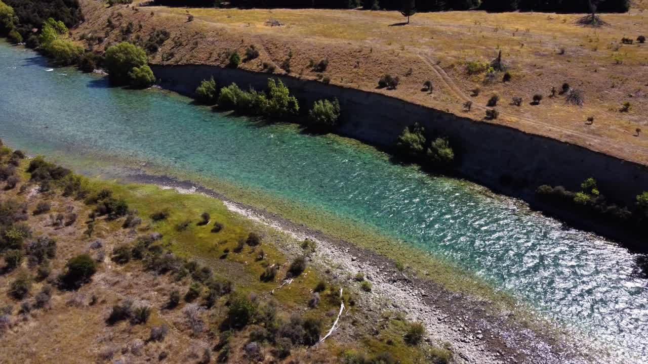 AERIAL Shot of a River Eroding through a Dry Landscape in Otago, New Zealand