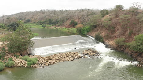 tilt down over a river, dam on a river in angola, africa