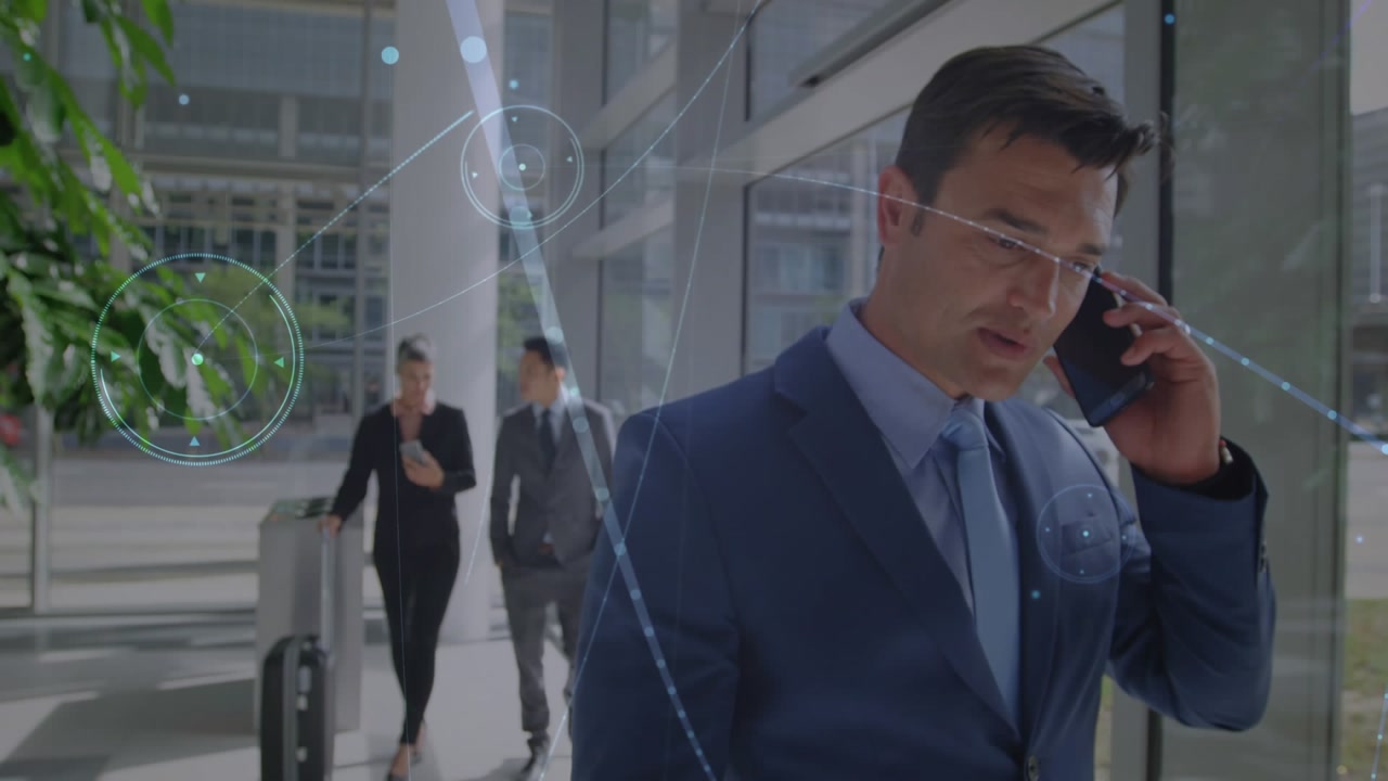 Animation of businessman talking business people over cityscape