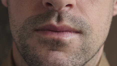 close-up-caucasian-man-mouth-unshaved-facial-hair-stubble
