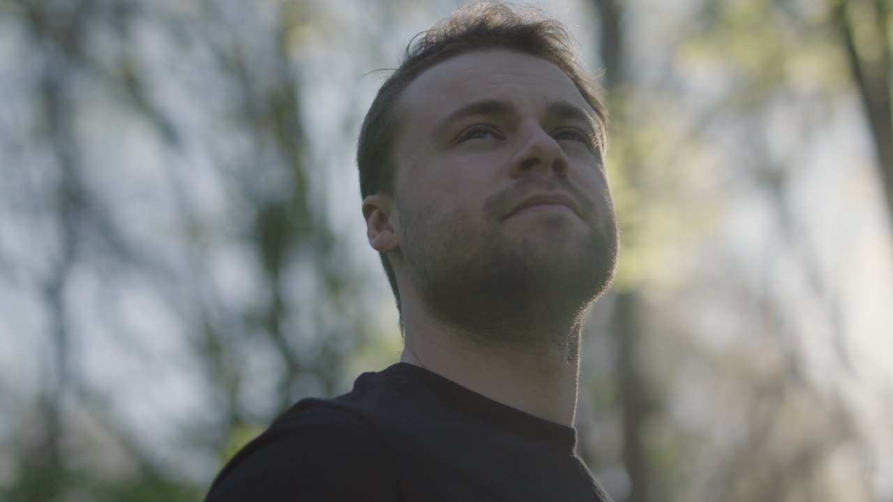 Portrait of a man looking up outdoors