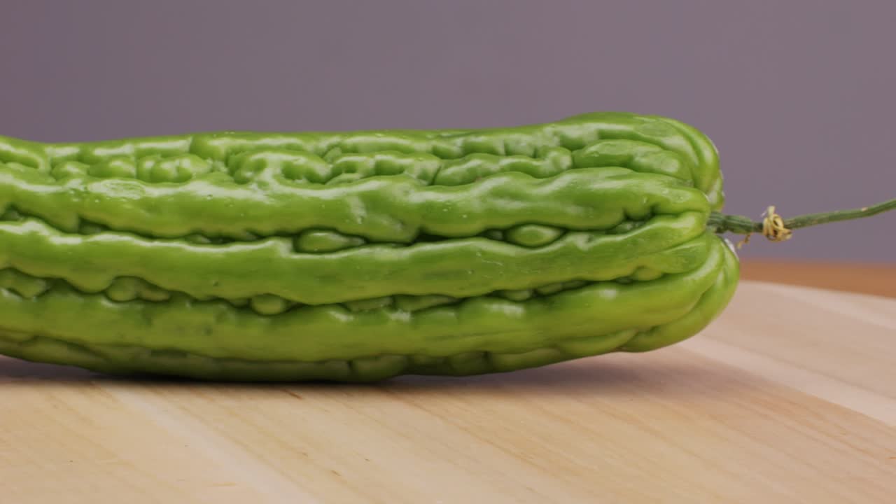 Bitter Melon on Wooden Cutting Board