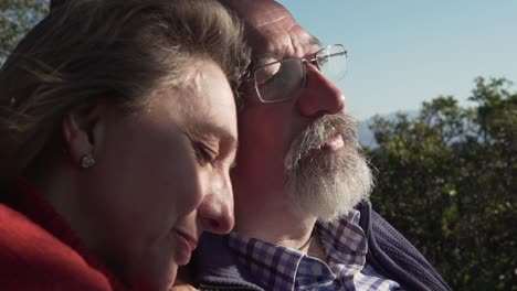 elderly couple relaxing together in nature