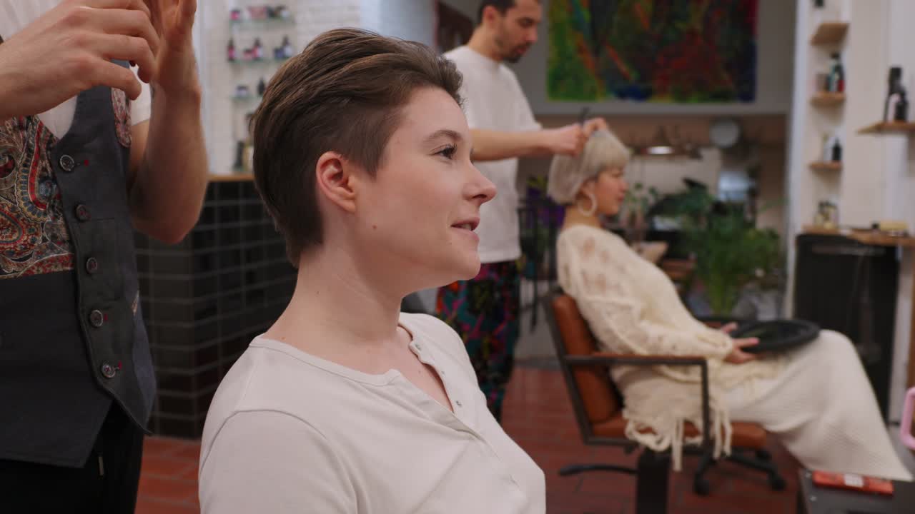 Customers getting haircuts in a hair salon