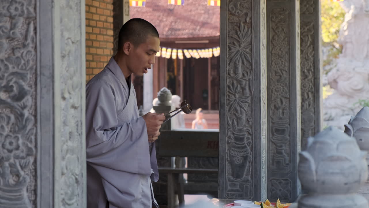 Buddhist Monk Performing Ritual in a Temple