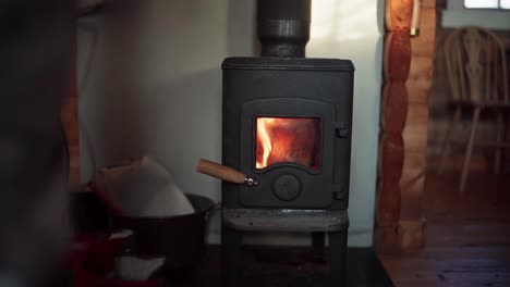 The-Man-is-Drying-His-Leg-in-Front-of-a-Heater-During-the-Winter-Season-in-Bessaker,-Trondelag-County,-Norway---Close-Up