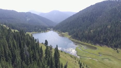 aerial - drone flies towards middle of lake