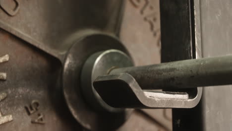 heavy barbell slamming down onto rack, close up, slow motion