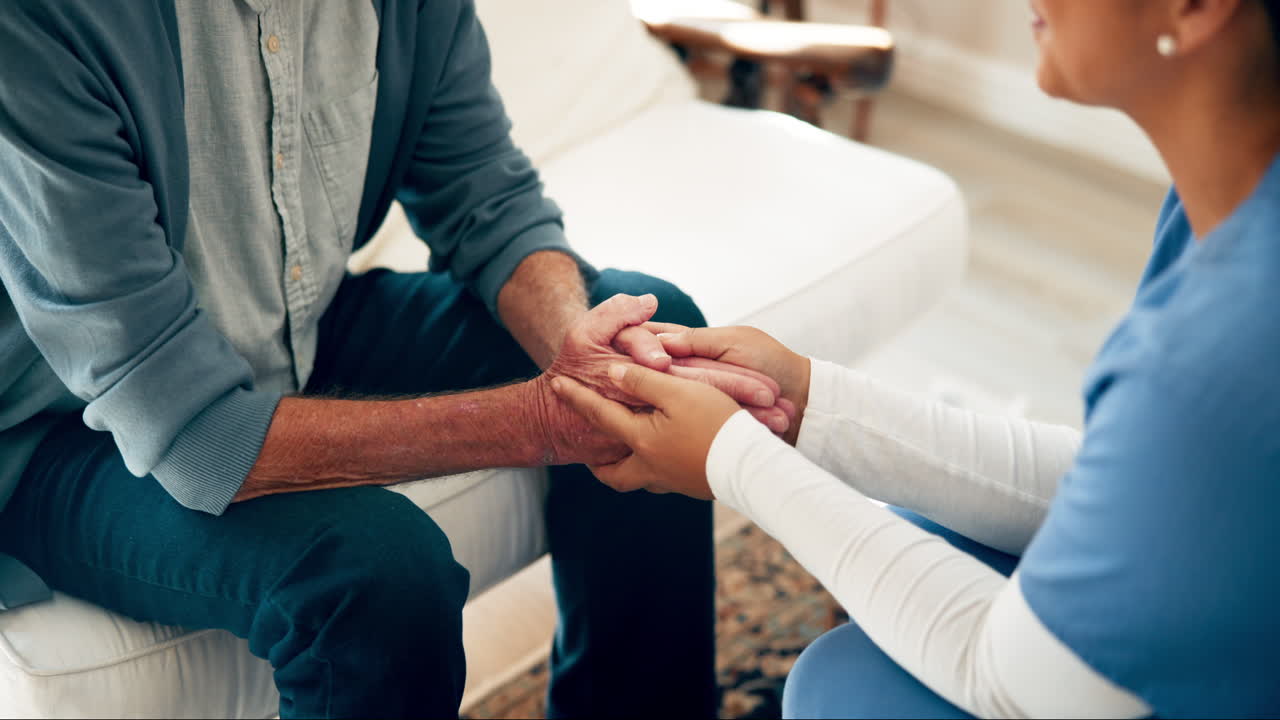 Compassionate Caregiver Comforting Senior Man