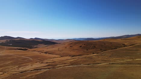 aerial-panoramic-view-during-a-sunny-summer-day-of-pietra-arsa-mountains-peak-in-Romania