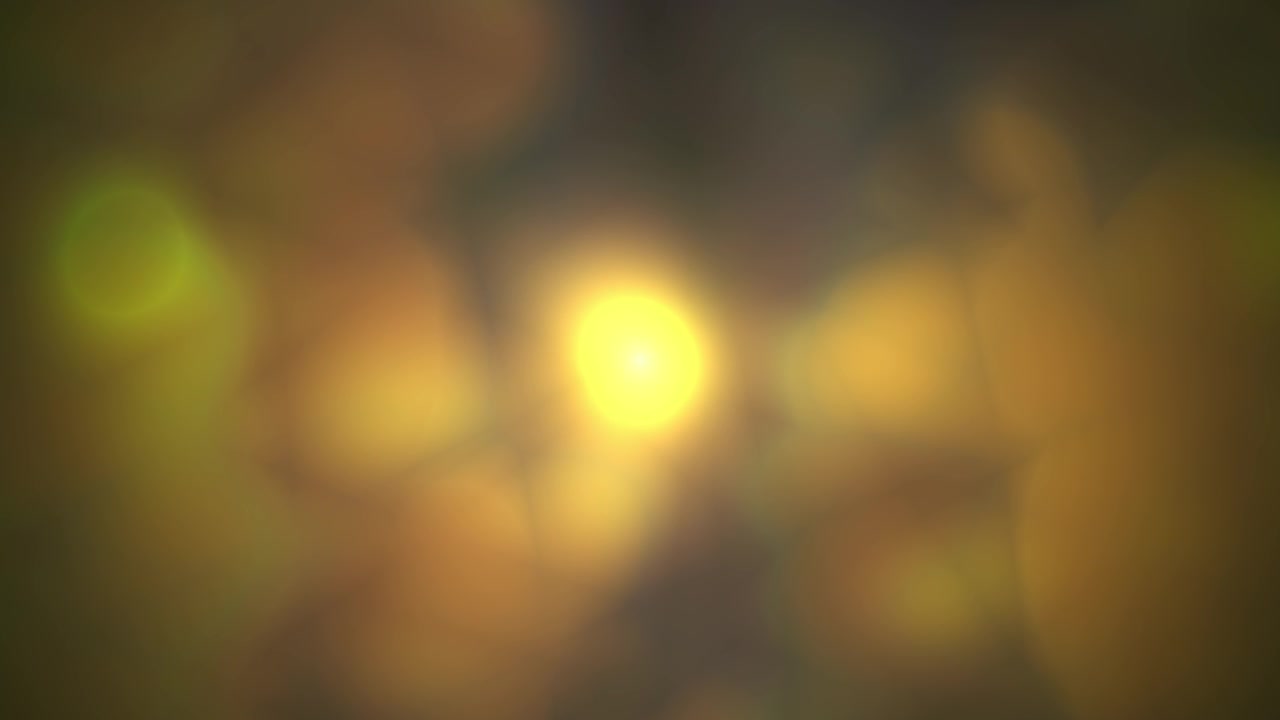Luce gialla calda astratta con bokeh e bagliore di lente