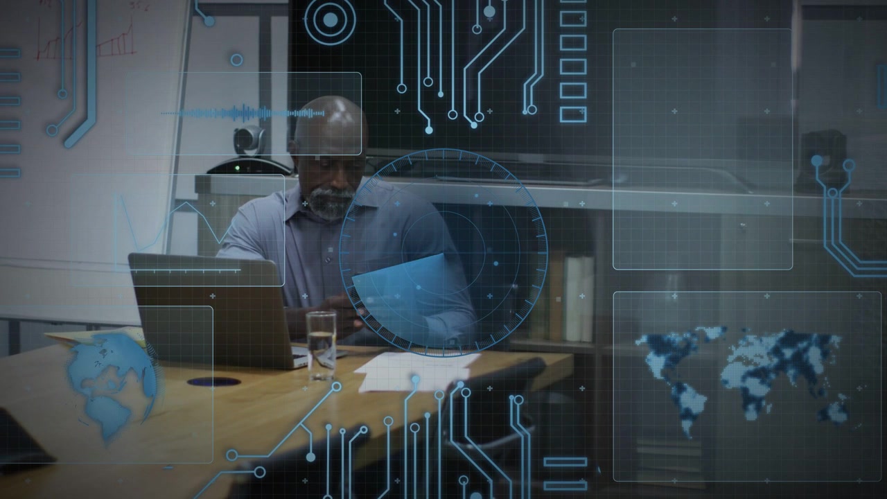 Man tapping smartphone glancing at laptop at table, animated radar and map driving tech review