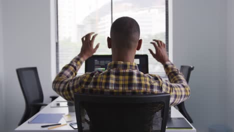 mixed race man on computer at office