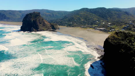 Aerial-overview-of-famous-New-Zealand-Piha-Beach-and-holiday-village