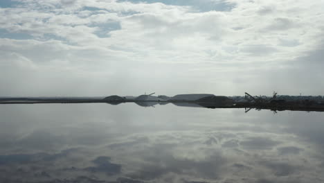 Mirror-reflection-over-salt-marshes,-Salin-d'Aigues-Mortes-aerial-drone