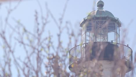 vintage lighthouse tower, retro light house, old fashioned beacon, fresnel lens.