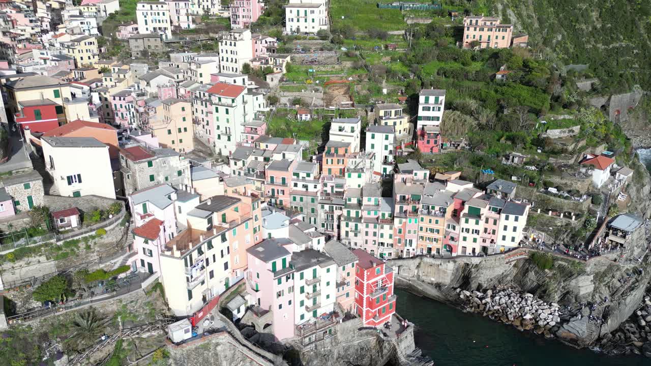 Riomaggiore Cinque Terre Italy aerial closeups of the town right on the ocean
