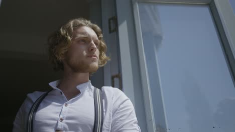 man by the window