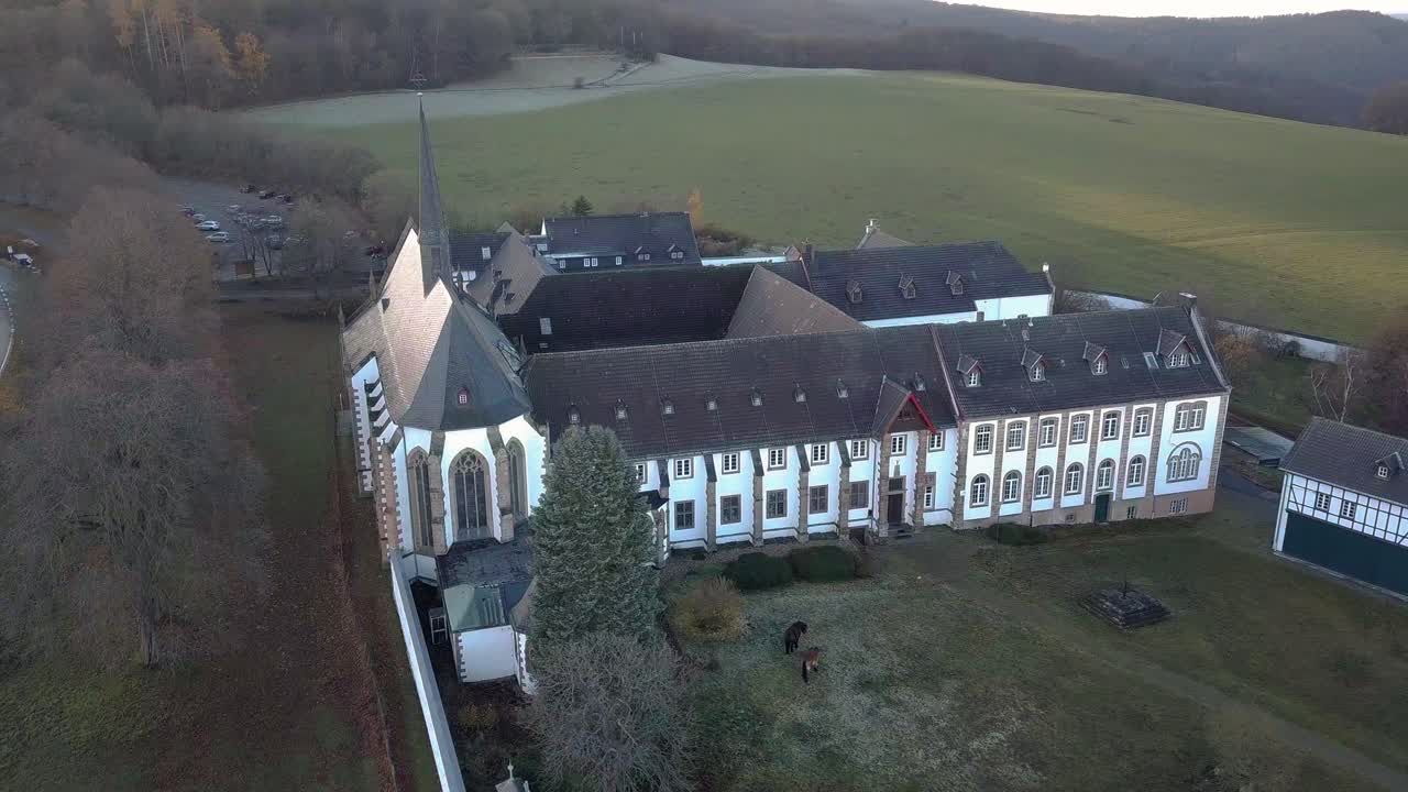 Panoramic aerial scene of the facade of the German Trappist monastery Mariawald Abbey.