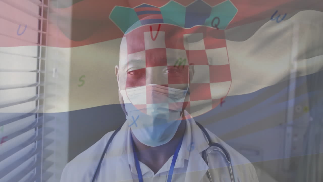 Animation of flag of croatia over african american male doctor in face mask