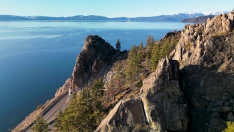 Aerial-view-of-Cave-Rock-and-rocky-forest-landscape,-Lake-Tahoe,-California