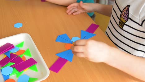 child playing with geometric shapes