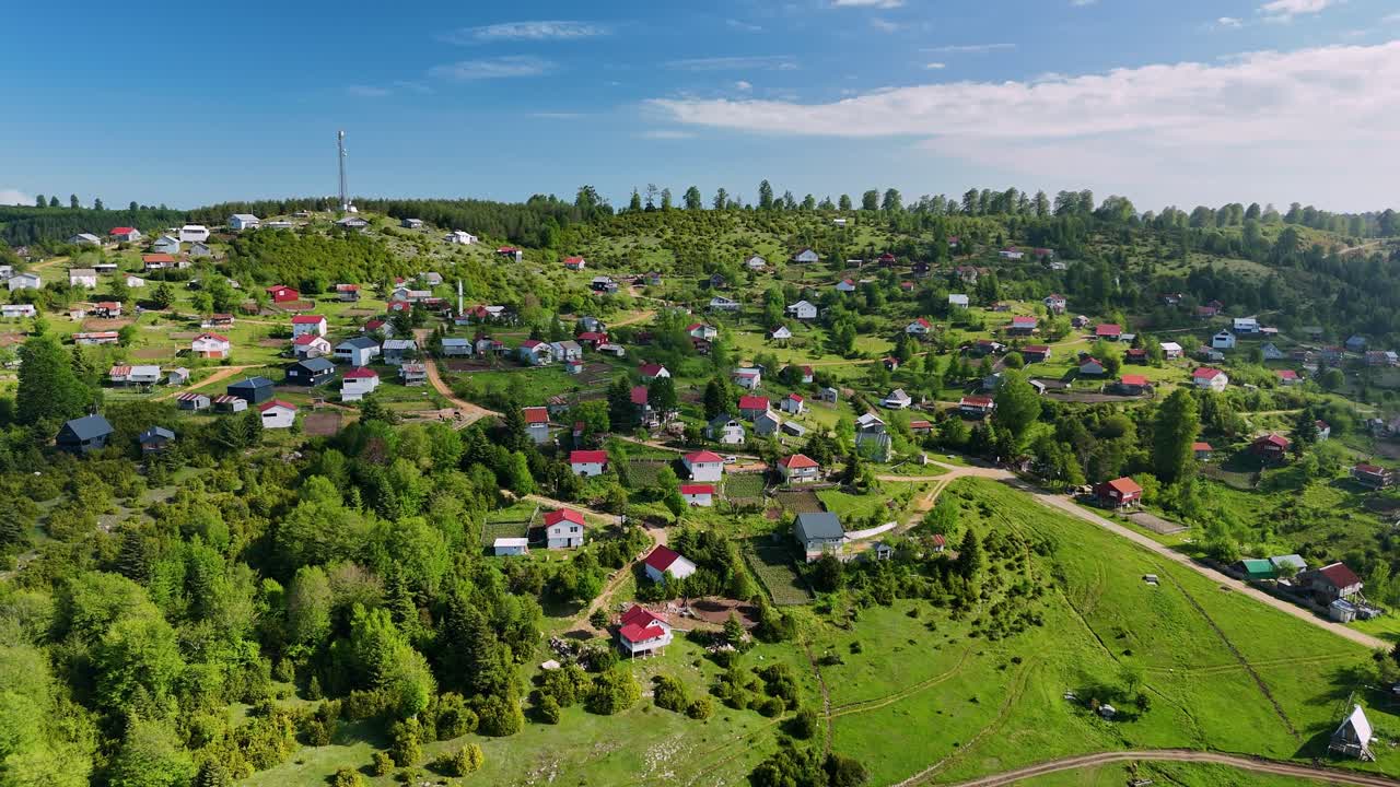 Charming rural village view with lush greenery under sunny skies