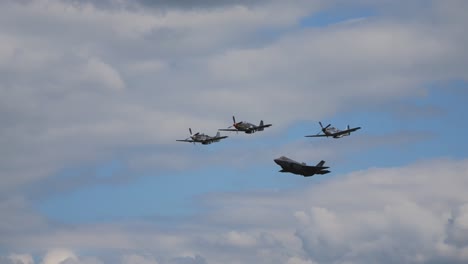 the f 35 military fighter aircraft flies side by side through the air with other aerobatic pilots at the airshow airpower