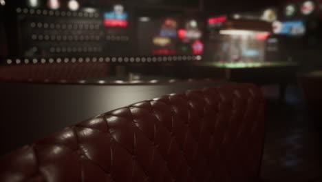 red leather booth in a dimly lit bar