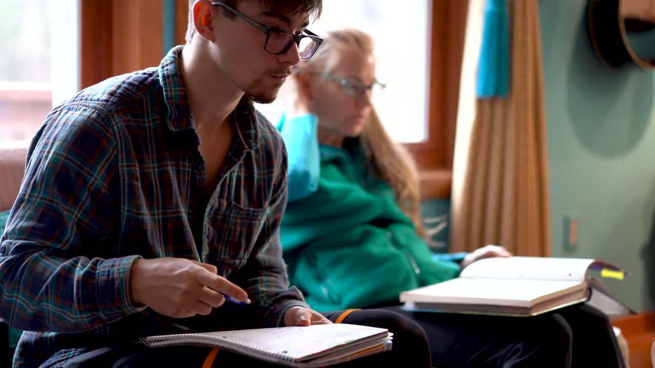 People writing indoors